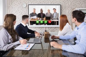 Group Of Business People Doing Video Conferencing In Business Meeting At Office